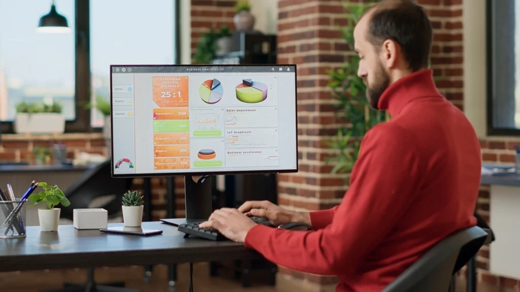 Business operations manager reviewing analytics dashboard to improve customer journey management and service performance