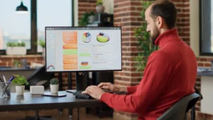 Business operations manager reviewing analytics dashboard to improve customer journey management and service performance